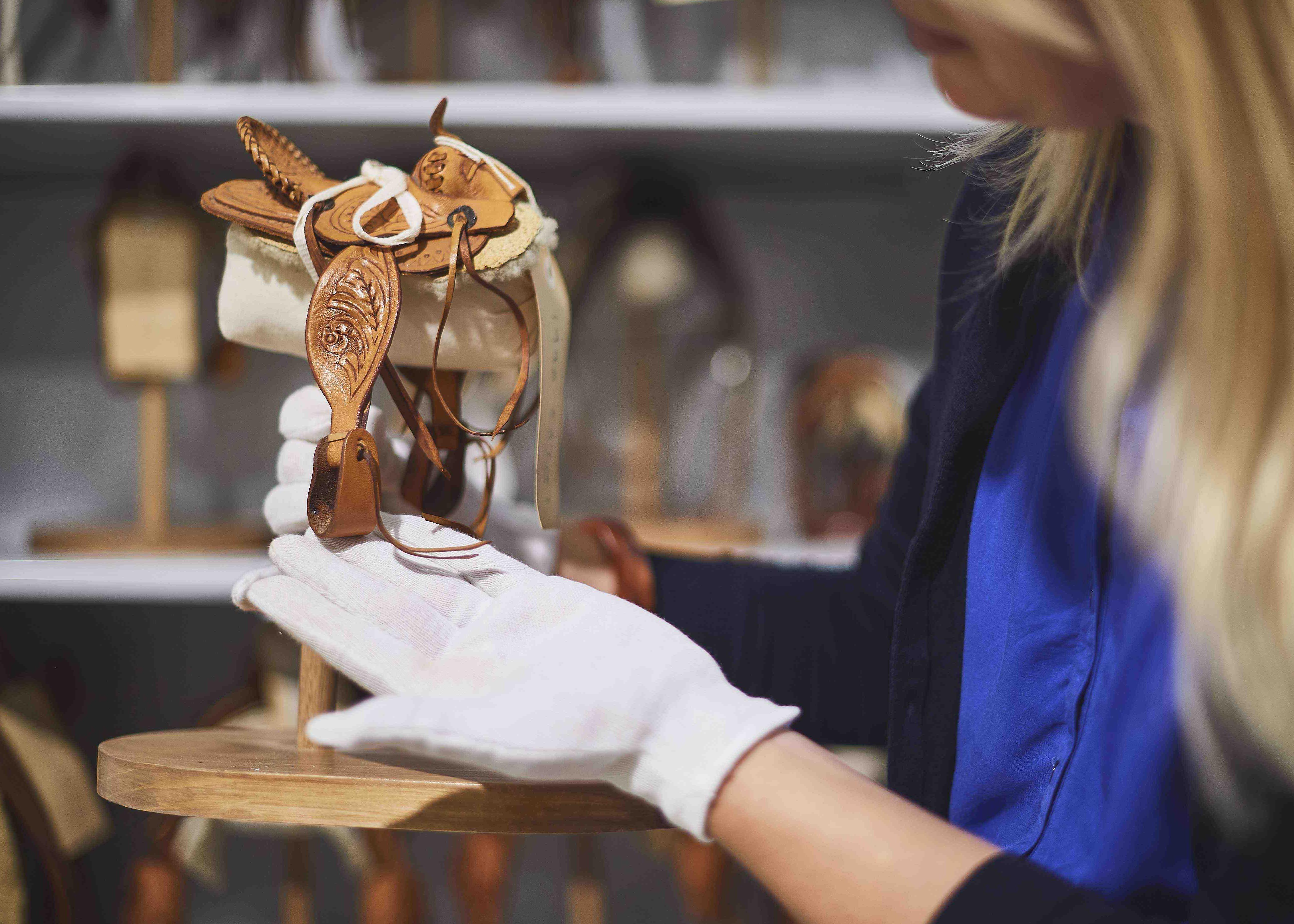 History and Heritage miniture saddles from the Whiteman Collection }}